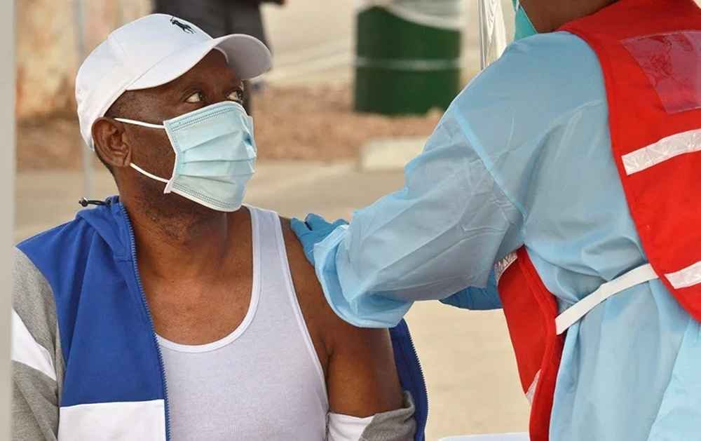 A man receiving Covid 19 vaccine