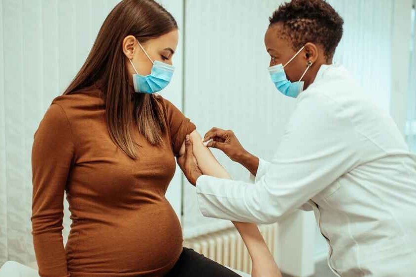 A pregnant woman receiving a RhoGam shot